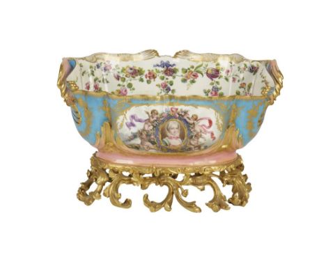 SEVRES PORCELAIN CACHEPOT of oval form, the central cartouche with a portrait surrounded by garlanded winged cherubs, on an i