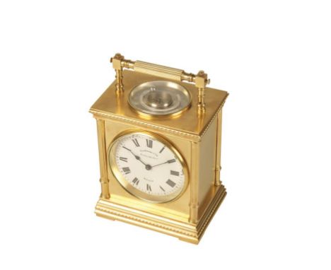 FRENCH BRASS CASED CARRIAGE CLOCK, the round white enamel dial with Roman numerals,inscribed "A LA GERBE D ' CR DUCELLIER ARC