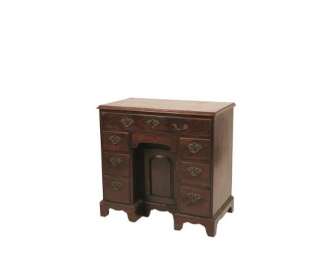 EARLY GEORGE III MAHOGANY KNEEHOLE DESK of good colour, apparently retaining the original open-plate brass handles, with a re