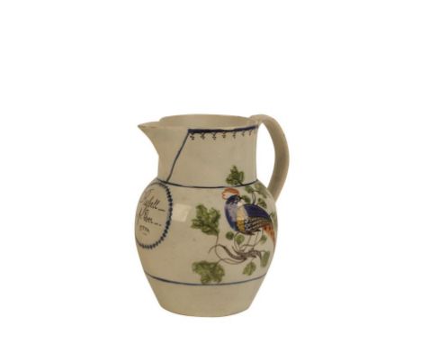 CREAMWARE JUG decorated in polychrome with an exotic bird on a leafy branch, with an oval panel inscribed "Russell forever", 