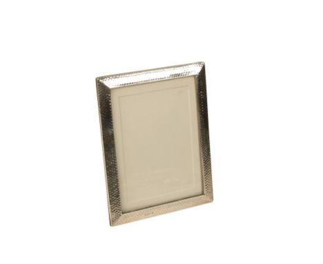 EDWARDIAN ARTS AND CRAFTS PHOTOGRAPH FRAME by E Mander & Son, Birmingham, 1903, rectangular form, planished decoration, leath