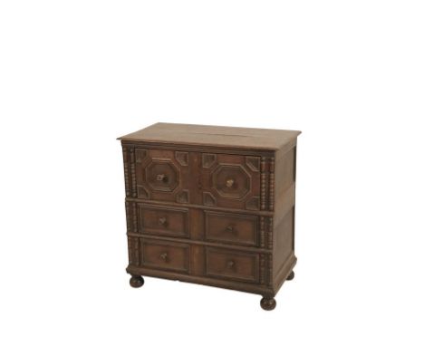 WILLIAM AND MARY OAK CHEST OF DRAWERS with a rectangular top over a geometrically moulded top drawer and two bolection-moulde