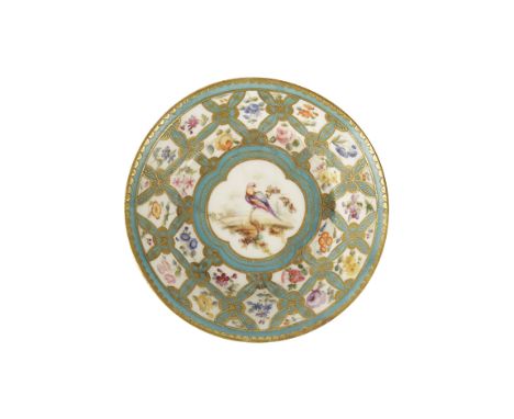 SMALL SEVRES DISH the central quatrefoil panel painted with an exotic bird, within floral bleu celeste and gilt diaper border
