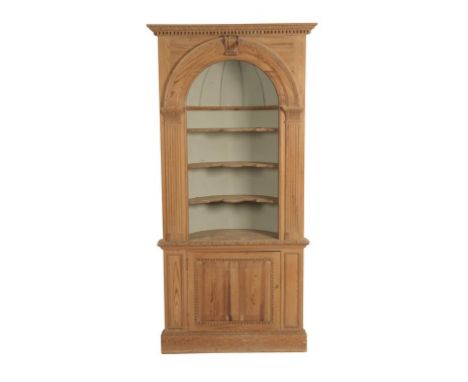 GEORGE II STYLE PINE CORNER CUPBOARD of architectural design, the open upper section with an arch enclosing a domed back, and