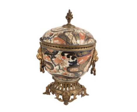 CHINESE IMARI OROMOLU MOUNTED VASE AND COVER with twin lion mask carrying handles, the cover surmounted by a foliate finial, 