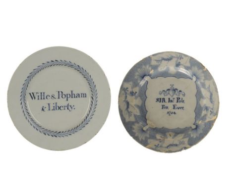 ENGLISH DELFTWARE PLATE, 18th century, inscribed "Willes. Popham & Liberty" in a leafy border, 23.5cm dia., and another Delft