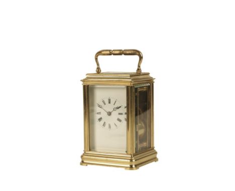 FRENCH BRASS CASED STRIKING CARRIAGE CLOCK the white enamel dial with Roman numerals, the movement striking on a bell, the ca