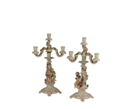 PAIR OF 18TH CENTURY DRESDEN STYLE TABLE CANDELABRA of rococo form, the bases modelled with Bacchanalian and floral putti, su