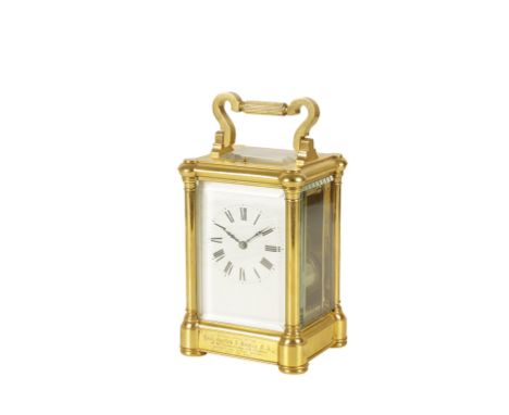 FRENCH BRASS CASED REPEATING CARRIAGE CLOCK, the white enamel dial with Roman numerals, striking on a coiled gong, the case w