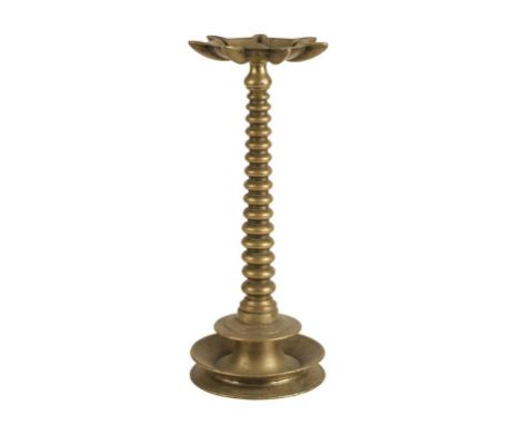 JUDAICA: A BRASS SABBATH LAMP with a tapering ring-turned stem and a dished circular base, with an inscription in Hebrew, 43.