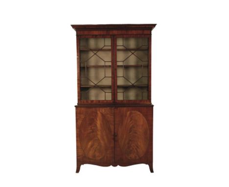 A GEORGE III MAHOGANY LIBRARY BOOKCASE, the upper section with twin astragal glazed doors enclosing a shelved interior above 