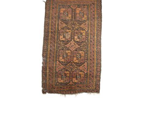 BOKHARA RUG, the brick red ground with a central rectangular panel worked with numerous diamond quadrilaterals and hooked bot