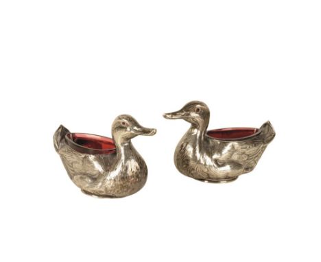 PAIR OF EDWARDIAN NOVELTY TABLE SALTS by Britton, Gould & Co, Birmingham, 1906, in the form of ducks, detachable ruby glass l