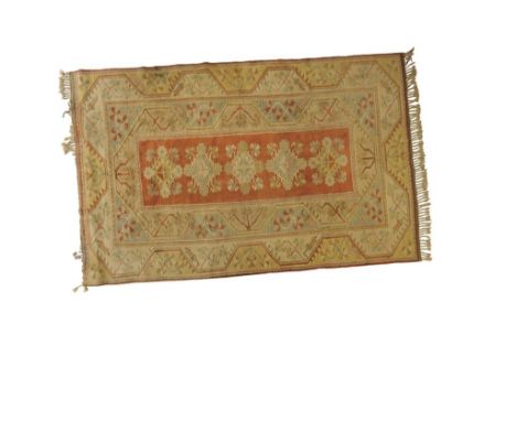 SOUTH WEST TURKISH MILAS TYPE LARGE RUG, the pale lemon and blue ground worked with stylised branches and flowers with a cora
