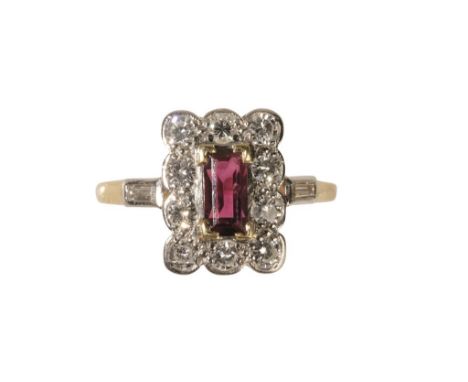 RUBY AND DIAMOND PLAQUE RING the baguette-cut ruby, surrounded by a border of ten round-cut diamonds, on an 18ct yellow gold 