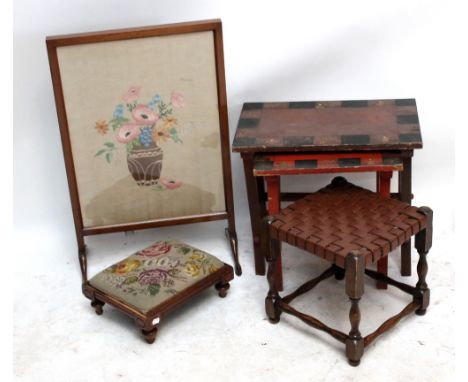 A Victorian foot stool, a leather upholstered stool, a red lacquered nest of tables and a firescreen (4).