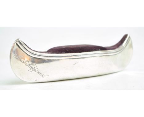 STOKES & IRELAND LTD; an Edward VII hallmarked silver canoe shaped pin cushion, Chester 1902, inscribed 'Much Happiness' to o