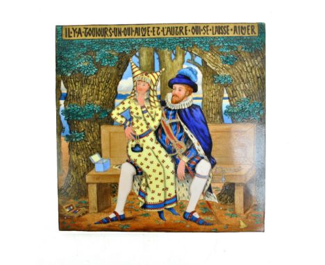 A porcelain hand painted square tile depicting a couple and inscribed in French 'There is always one who loves and one who is