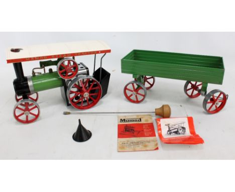 A boxed Mamod TE1 steam tractor and OW1 open wagon with steering rod, burner, funnel and two leaflets. CONDITION REPORT: Play