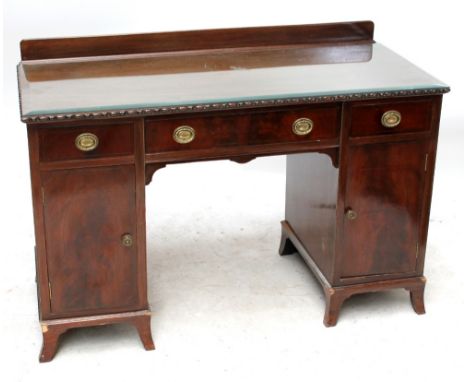 An Edwardian mahogany kneehole desk with three drawers above twin cupboard doors on splay bracket feet, width 122cm.