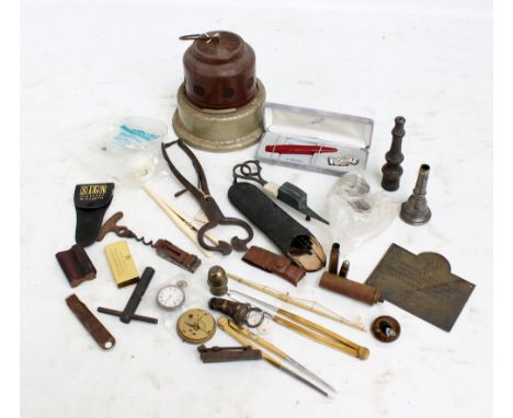 A mixed lot of collectors' items to include a Chalwyn car radiator heater, a Lund patterned corkscrew, a copper candle snuffe