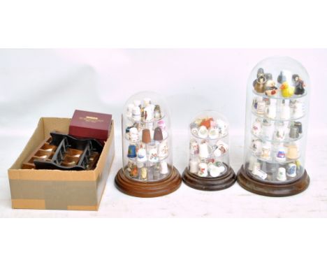 A collection of various predominantly ceramic thimbles to include Port Meirion, Coalport and Fenton China Co, and novelty fig