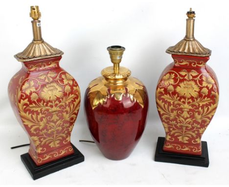 Two ceramic rectangular baluster vases painted with floral and foliate motifs on red ground, height 53cm including fitment, a
