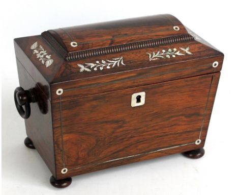 A rosewood and mother of pearl inlaid sarcophagus form tea caddy with two division twin lidded interior, length approx 20cm. 