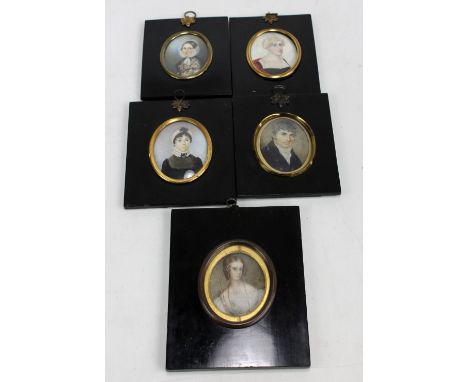 Five 19th century oval portrait miniatures on ivory to include a gentleman in a blue coat, length 7cm, and a woman wearing a 