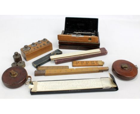 A collection of geometry instruments to include a rosewood cased set, a set of four ivory rulers by Cooke, Troughton & Simms 