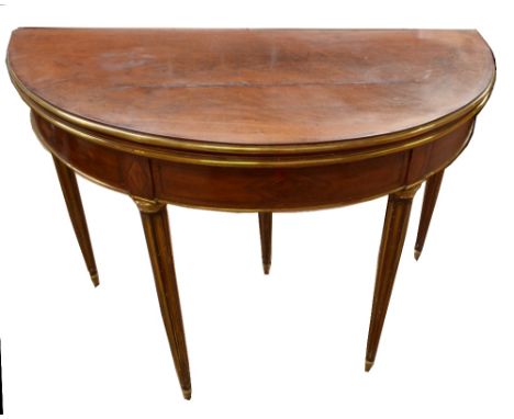 A French mahogany card table with inset purple baize to top and brass detail on tapered legs, diameter 109cm. CONDITION REPOR