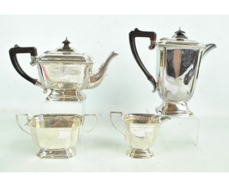 ELKINGTON & CO; an Edward VIII hallmarked silver four piece tea set comprising a rectangular teapot with fluted corners, on s