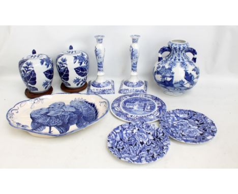 A group of blue and white ceramics to include a pair of Spode candlesticks, a twin handled Oriental style globular vase and a