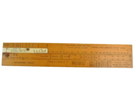 A Gangaram's Patent slide rule retailed by Stanley of London with small sliding ivory section above a full length further sli