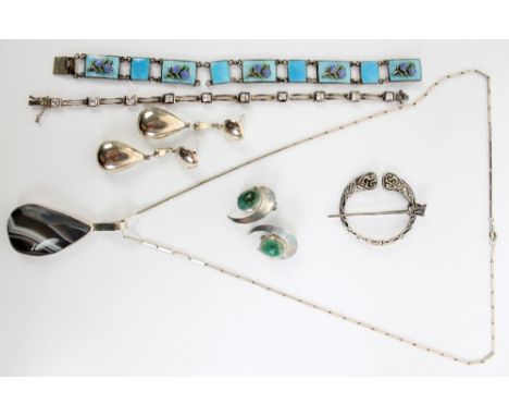 A small group of silver jewellery to include an Israeli agate set pendant, a pair of ear clips, a Scottish brooch and a guill