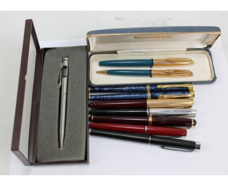 A cased Waterman fountain pen and propelling pencil set with 14ct gold nib and rolled gold caps, with manual, a Parker founta