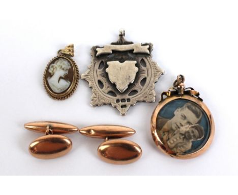 A small group of jewellery comprising a pair of 9ct hollow cufflinks, a gold framed cameo pendant, a yellow metal double glaz
