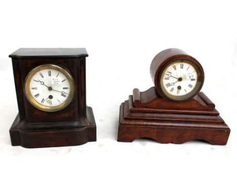 A late 19th century simulated wood slate mantel clock, width 30cm and a further ebonised example (both af) (2).