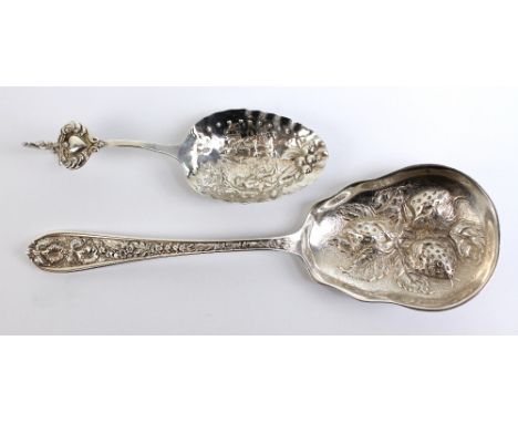 STIEFF; a sterling silver strawberry embossed fruit serving spoon, length 21cm, and a white metal caddy spoon embossed with f