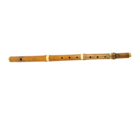 GOULDING D'ALMAINE & CO OF LONDON; a boxwood and ivory mounted four sectioned flute, each section stamped, overall length 50c