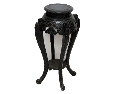 A Chinese carved and ebonised hardwood jardinière stand, height 84cm. CONDITION REPORT: Joints are loose, the stand is quite 