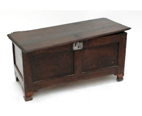 An early 18th century oak coffer of simple construction raised on later bracket feet, width 113cm.