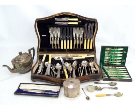 A mixed lot of electroplated items including an oak canteen containing a cutlery set, a teapot, tea caddy, etc.