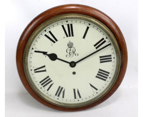 A George V walnut cased twin dial 'Post Office' clock, both dials set with Roman numerals and royal ciphers, diameter approx 