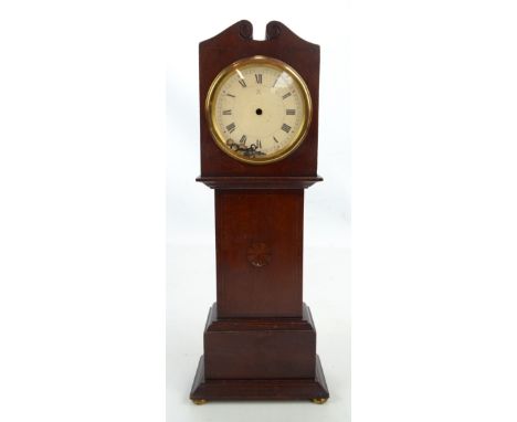 A miniature George III style mahogany battery operated longcase clock, with Roman numerals, with inlaid star burst decoration