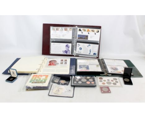 A collection of first day covers, also commemorative coin sets, etc.