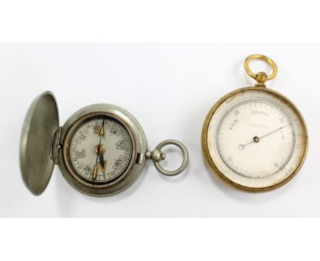 A compensated pocket barometer in gilt metal case and a pocket compass no.196685 to case interior (2). CONDITION REPORT: Exte