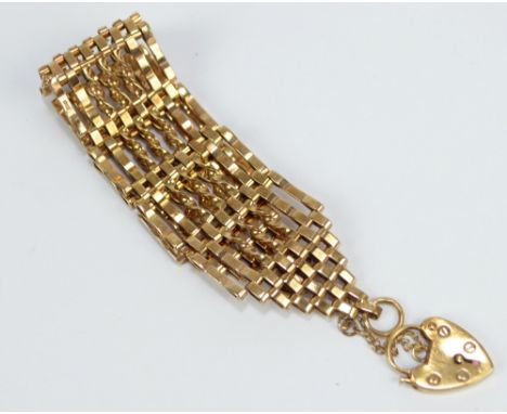 A 9ct yellow gold broad gate link bracelet, approx 26.7g.