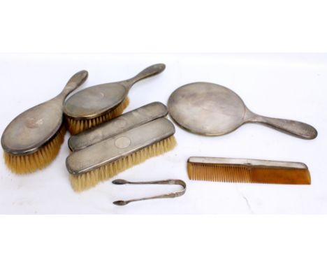 SYNYER & BEDDOES; a George V hallmarked silver backed six piece dressing table set with overall engine turned decoration and 