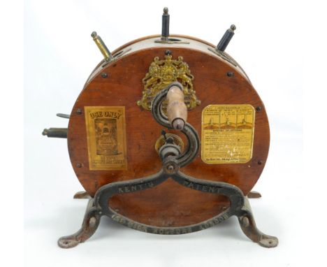 A Kent's vintage knife cleaning/polishing machine, still retaining paper labels and with elaborate armorial, height approx 51